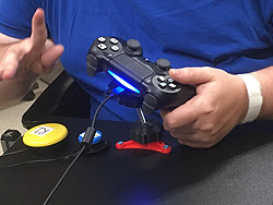 A person using a game console controller