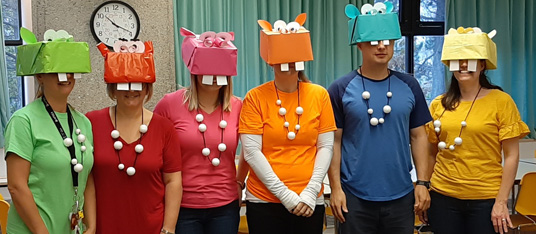 Staff dressed as characters from the game Hungry Hippos