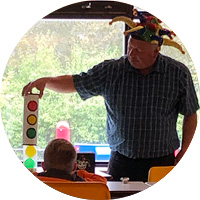 Magician performing a trick for child