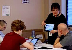 Staff demonstrating with an iPad