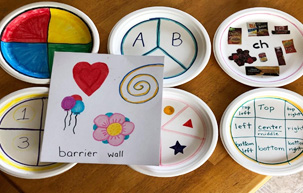 Plates with letters, numbers, shapes, speech sounds, locations.