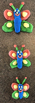 3 different sized butterflies made from playdough