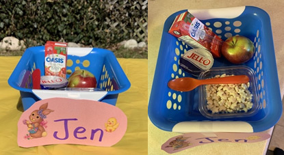 Baskets with a Juice box, apple, Jello, a spoon and popcorn
