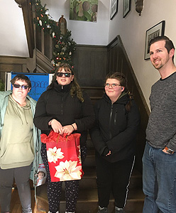 Students standing infront of a stairway