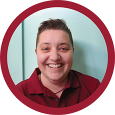 Von wearing a red collared shirt, pictured against a light-colored background.